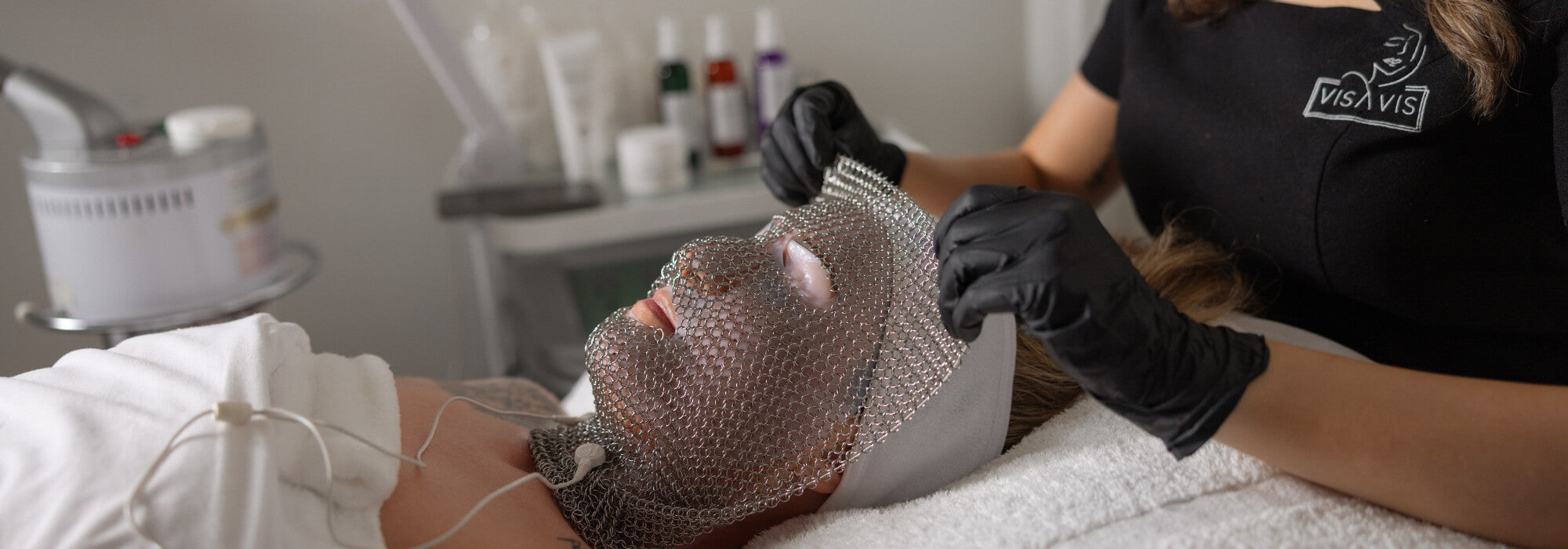 Client undergoing LIFTED facial at Vis A Vis with chain mask applied using Dermotechnology technology